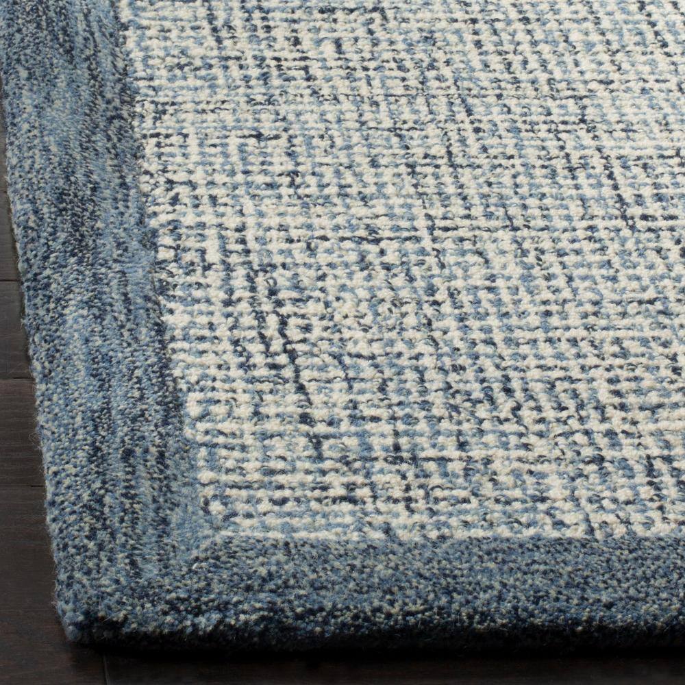 Navy and Ivory Handmade Wool Tufted 5' x 8' Area Rug