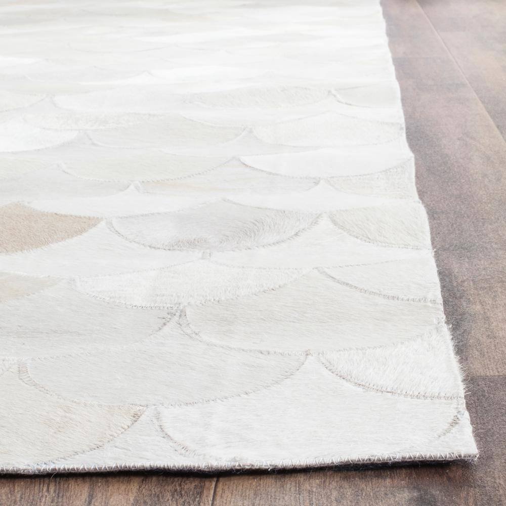 Ivory Geometric Handmade Cowhide Area Rug