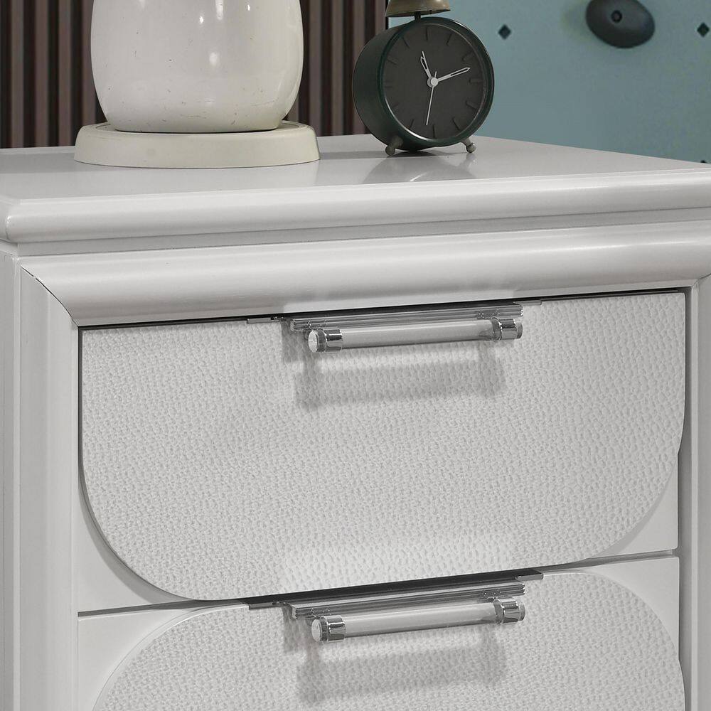 Close-up of a pearl white drawer with a textured front and silver pull.