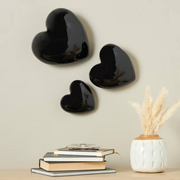 Litton Lane Ceramic Black Slanted Heart Wall Decor with Varying