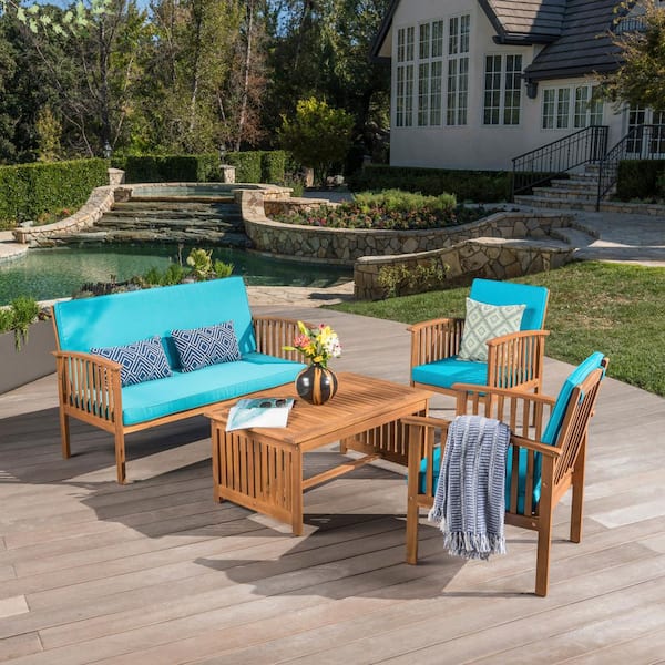 Zeus & Ruta Brown 4-Piece Wood Patio Conversation Set with Acacia Wood Table and Teal Cushions