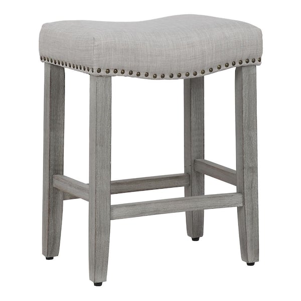 WESTINFURNITURE Jameson 24 in Counter Height Antique Gray Wood Backless Nailhead Trim Barstool with Upholstered Gray Linen Saddle Seat