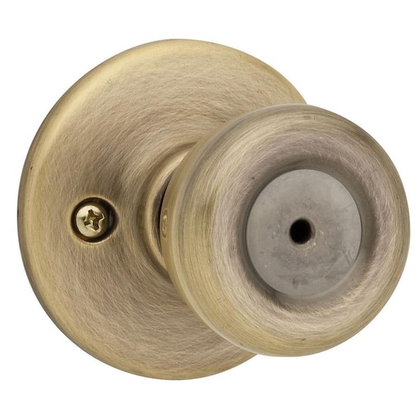 Kwikset Tylo Antique Brass Bed/Bath Door Knob Featuring Microban Antimicrobial Technology with Lock