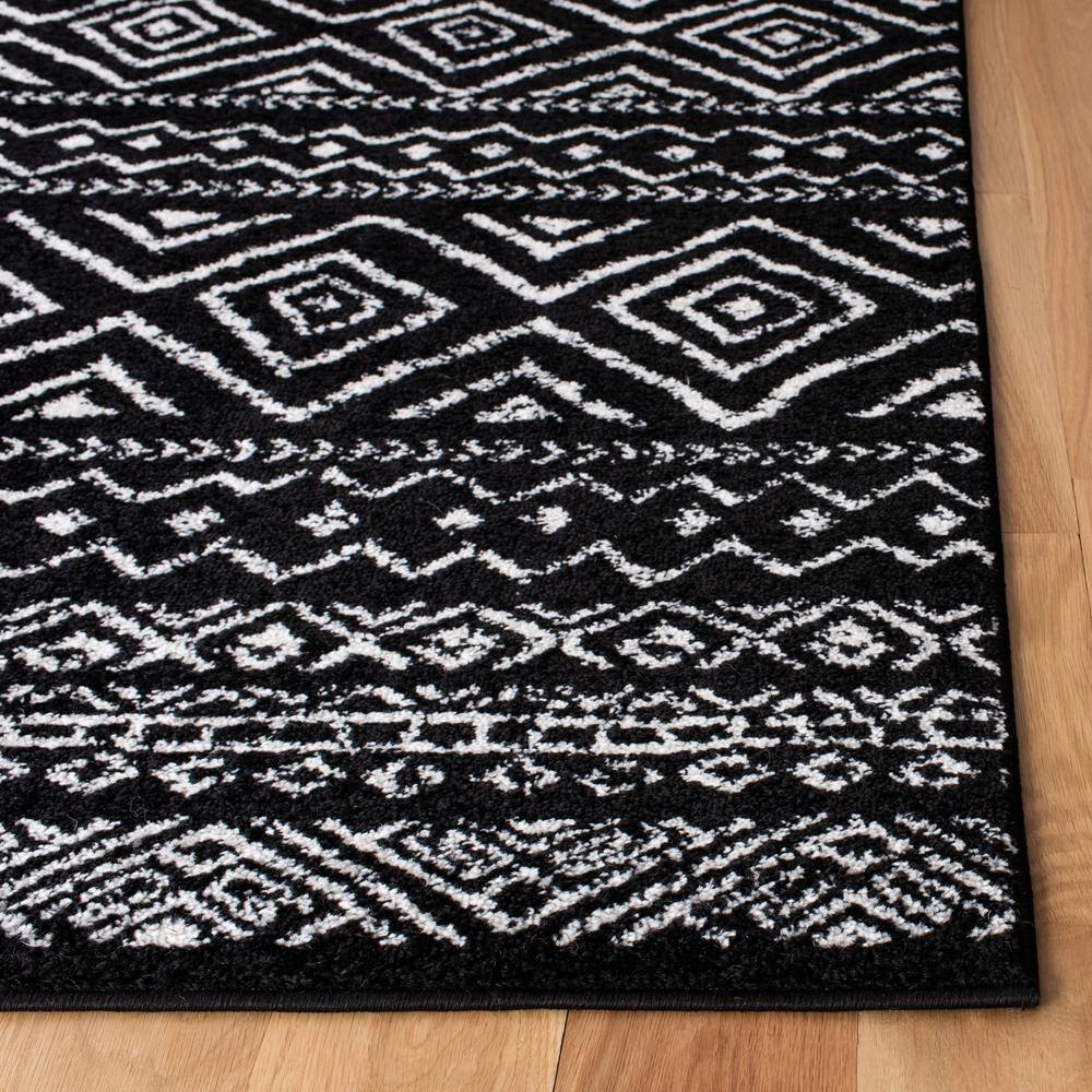 Geometric Black/Ivory Synthetic 8' x 10' Hand-knotted Area Rug