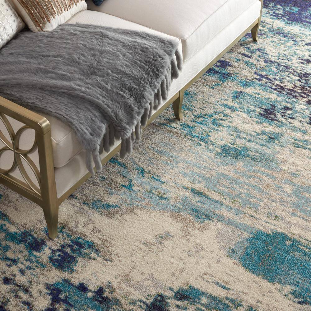 Celestial Swirl 9' x 12' Ivory & Teal Blue Abstract Synthetic Rug