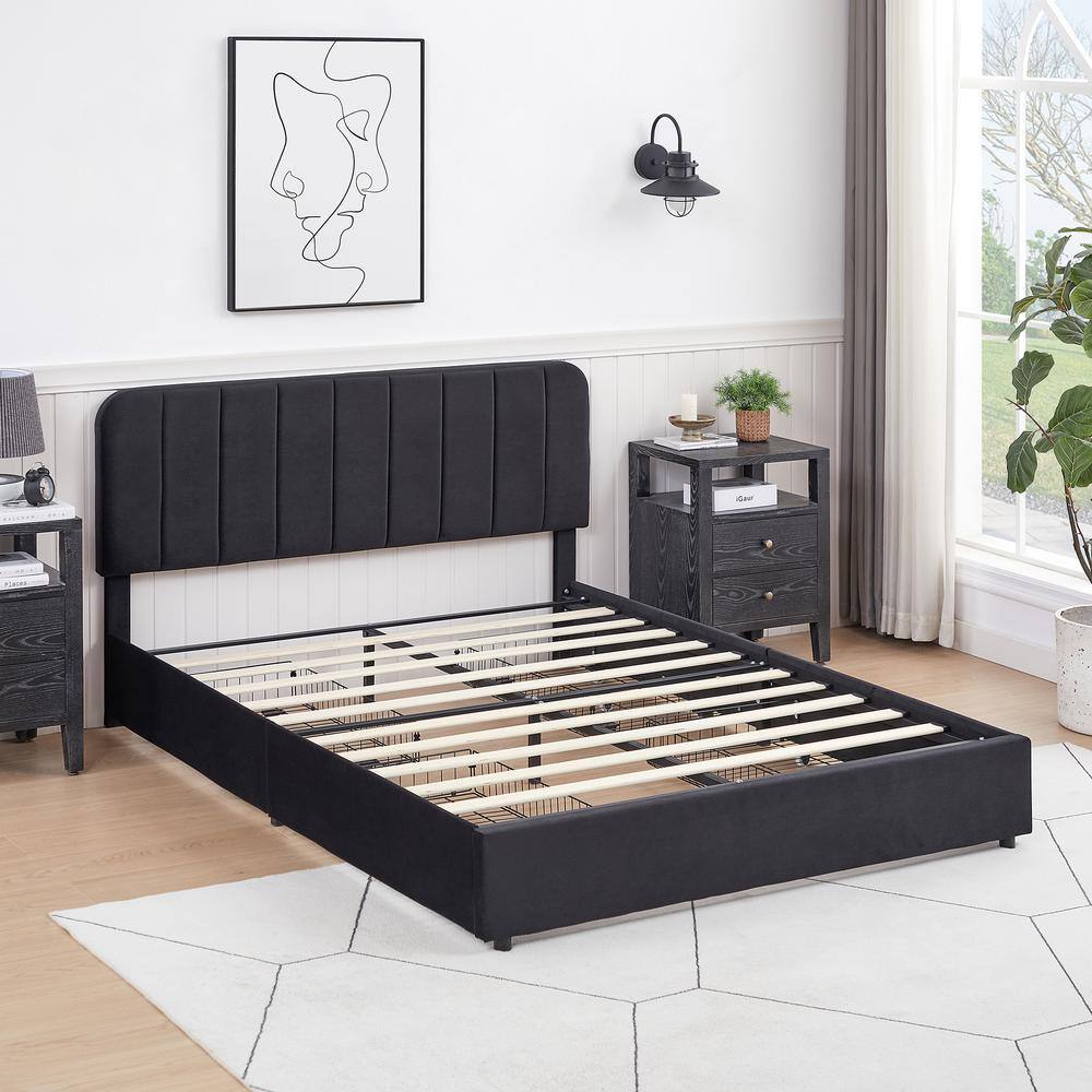 Queen platform bed frame with metal slatted base in a bedroom.