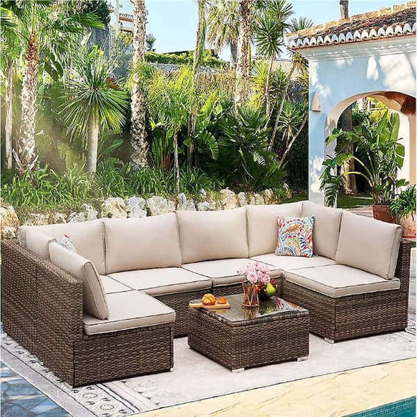 7-Piece Light Brown Wicker Outdoor Sectional Sofa Set with Beige Cushions and Ottomans