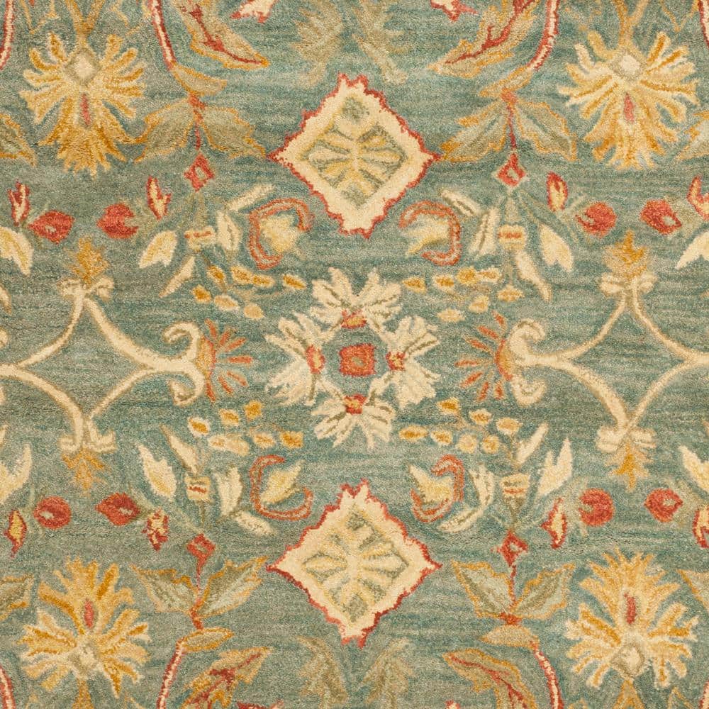 Handmade Light Blue and Ivory Floral Wool 6' x 9' Area Rug