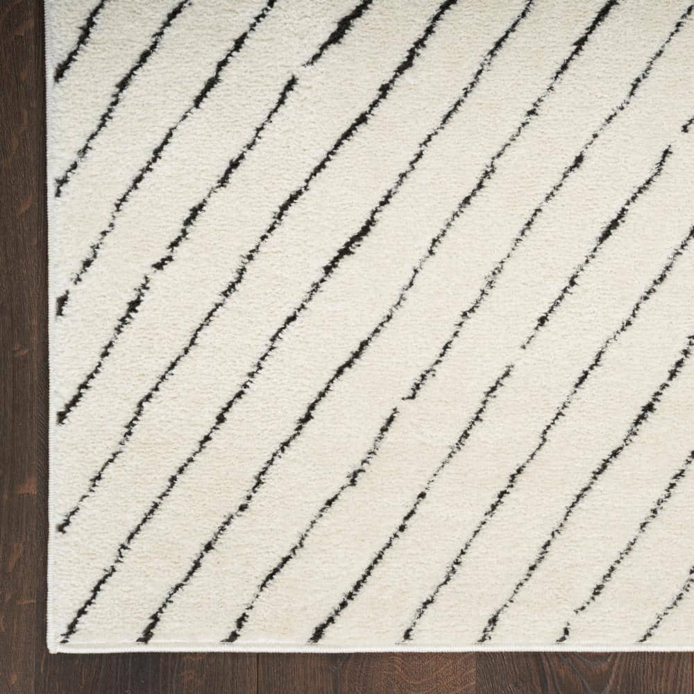 Ivory Black Abstract 8' x 10' Synthetic Area Rug