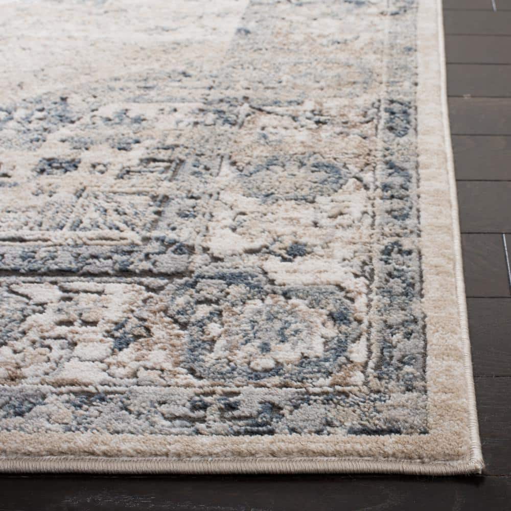 Ivory and Blue Floral Medallion 9' x 12' Synthetic Area Rug
