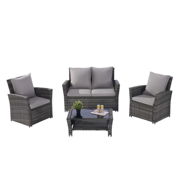Zeus & Ruta Gray 4-Piece Rattan Wicker Patio Conversation Set with Tempered Glass Coffee Table and Light Grey Cushions
