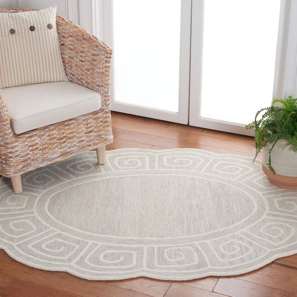 Novelty 5 ft. x 7 ft. Beige/Ivory Swirl Border Oval Area Rug