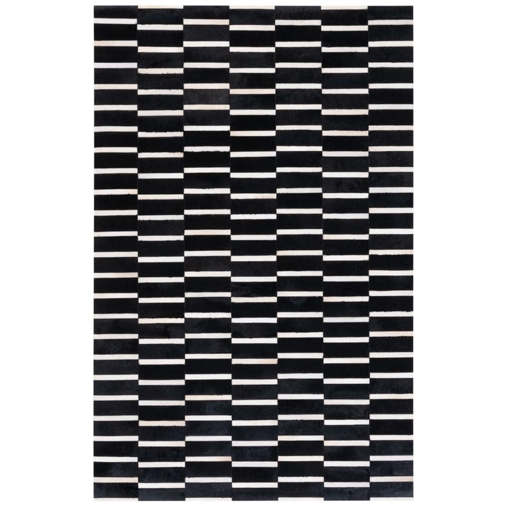 Handmade Black and Beige Geometric Cowhide Area Rug