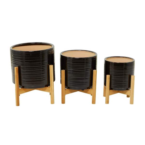 Litton Lane 13 in., 11 in., and 10 in. Medium Black Ceramic Planter with Removable Wood Stand (3- Pack)