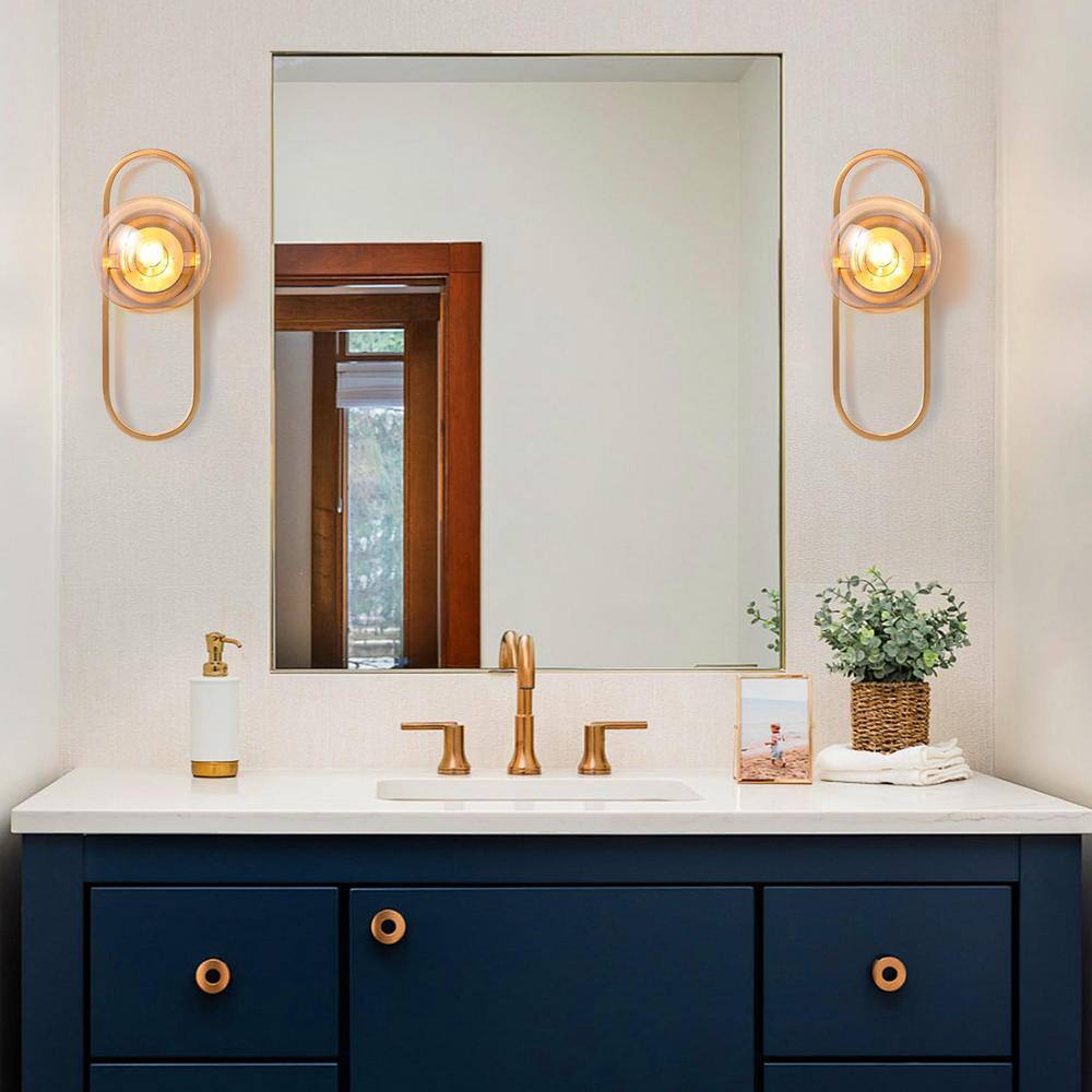 Modern Gold Metal Sconce with Clear Glass Globe Shade