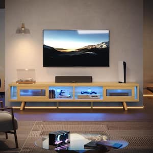 70 in. Mid-Century TV Stand Fits TVs up to 75 in. with LED Light Ribbed Glass Sliding Door and Open Shelves Natural Oak