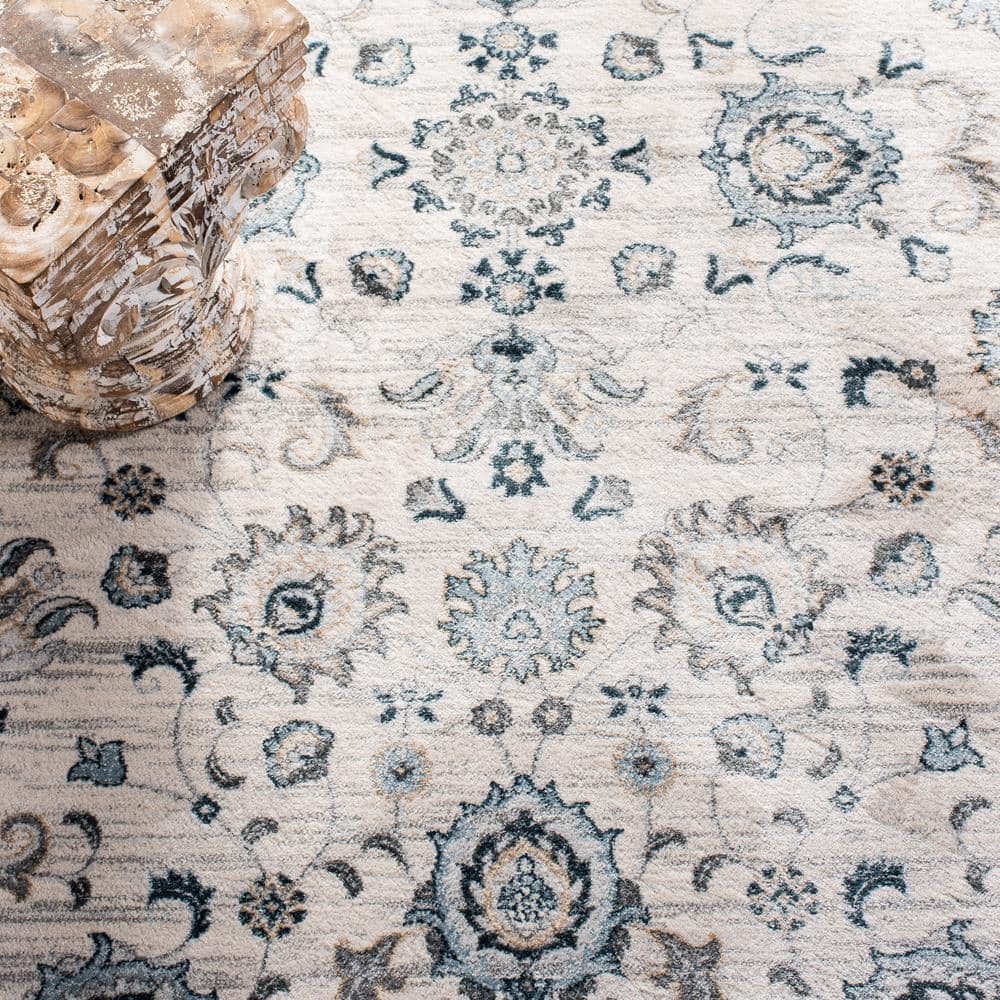 Isabella Cream and Navy 4' x 6' Synthetic Oriental Area Rug