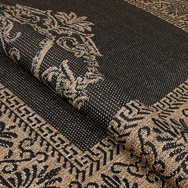 https://images.thdstatic.com/productImages/eb737990-2946-49dd-a5b5-0df72e2a38d7/svn/black-cocoa-couristan-outdoor-rugs-10783115023119u-1f_600.jpg