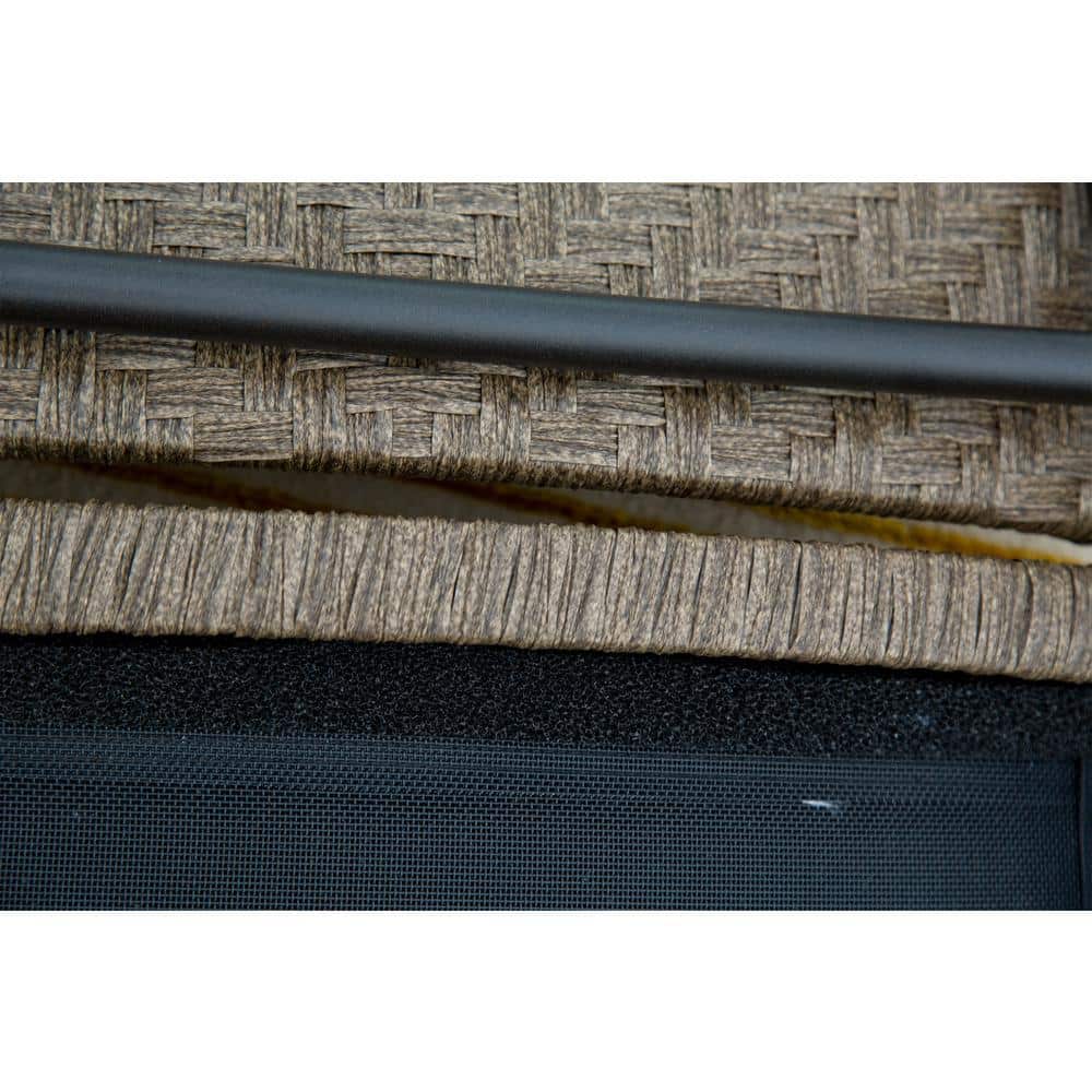 Close-up of the woven fabric and black frame detail of the chaise lounge.