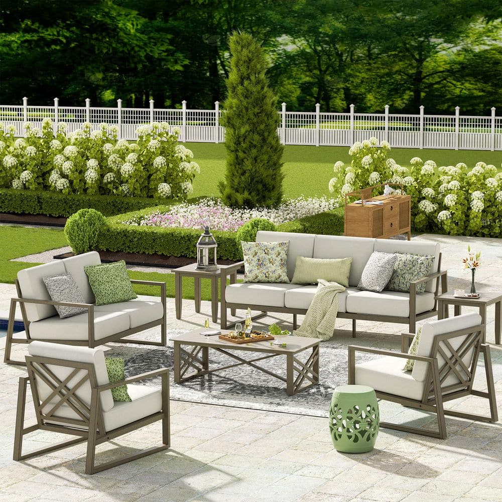 Complete Hamarto outdoor furniture collection in a landscaped garden.