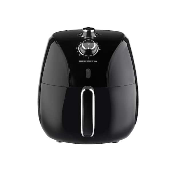 a black deep fryer or oil free fryer , air fryer appliance is on white  marble table