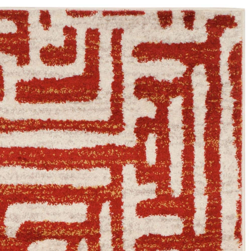 Ivory and Terracotta Geometric Synthetic Area Rug, 5' x 8'