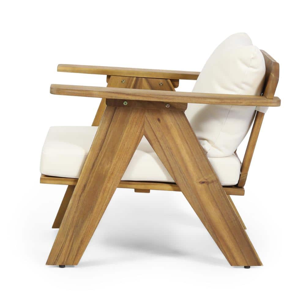 Close-up of the wooden frame and cushion of a lounge chair.