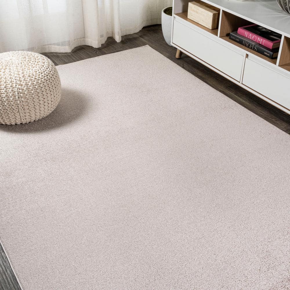 Beige Solid Low-Pile Synthetic Indoor Area Rug
