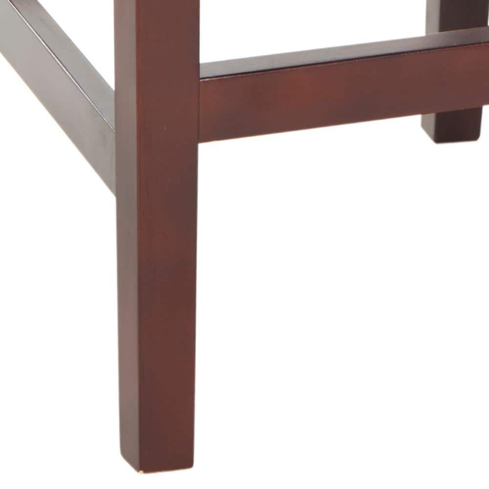 Close-up of the dark brown wooden leg and footrest