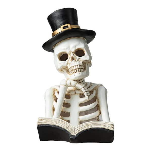 10.25 in. H Halloween Lighted Resin Skull Reading Book Table Decor