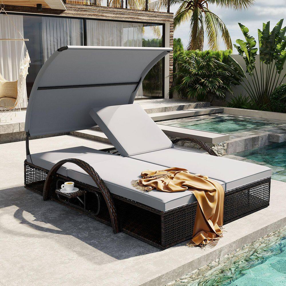 Brown Metal Outdoor Patio Double Day Bed with Gray Cushions with Hidden Side Table and Arched Armrests