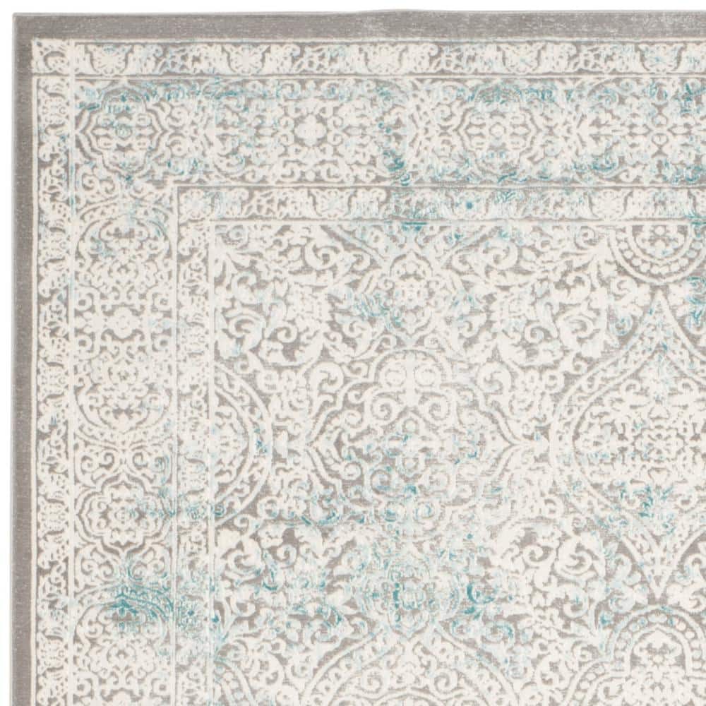 Elysian Ivory & Turquoise 9' x 12' Synthetic Reversible Area Rug