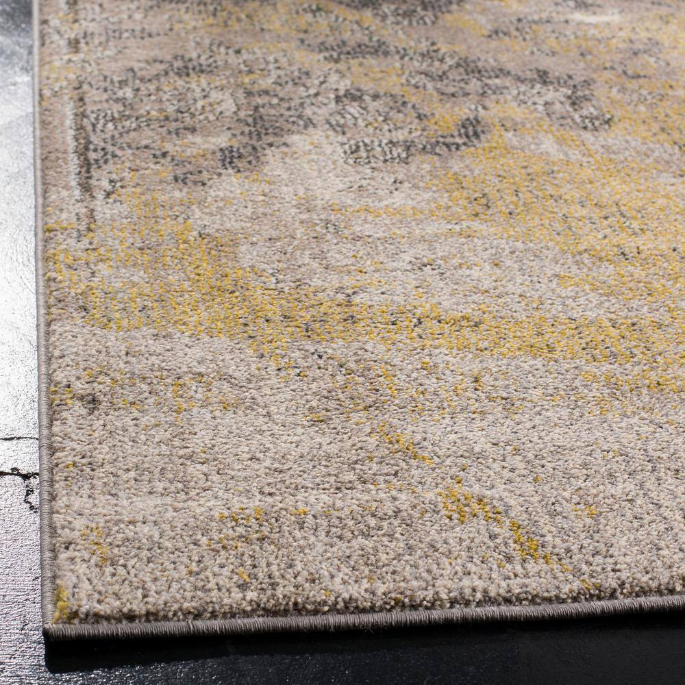 Ivory and Gray Abstract 9' x 12' Synthetic Area Rug