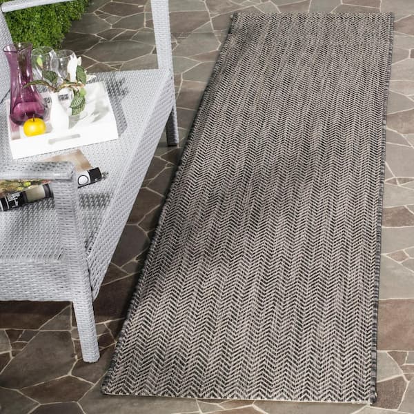 Courtyard Black/Beige 2 ft. x 20 ft. Solid Color Chevron Indoor/Outdoor Runner Rug