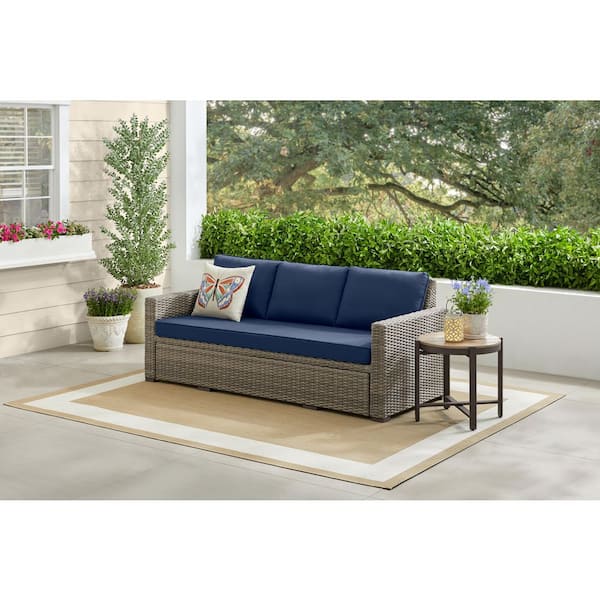 Clarington 1-Piece Wicker Outdoor Convertible Sofa with CushionGuard Navy Cushions