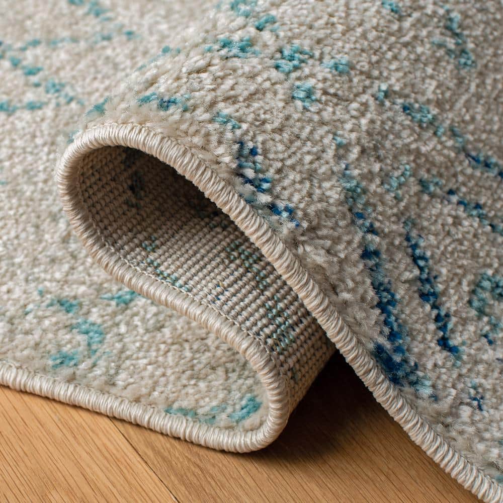 Elegant Ivory/Aqua Synthetic 9' x 12' Hand-Knotted Area Rug