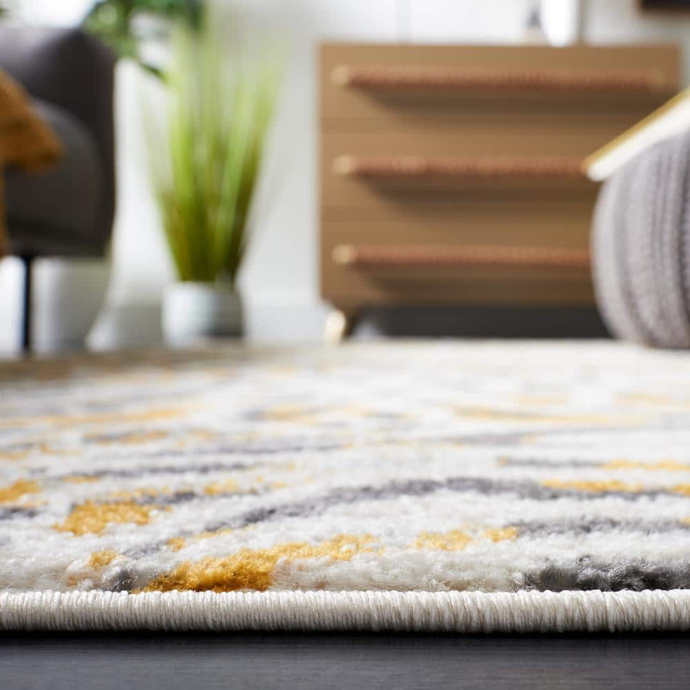 Ivory and Gold Synthetic Round Hand-knotted Rug