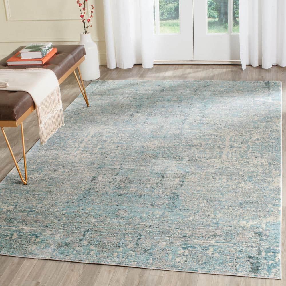 Teal and Multicolor Abstract Synthetic 4' x 6' Area Rug