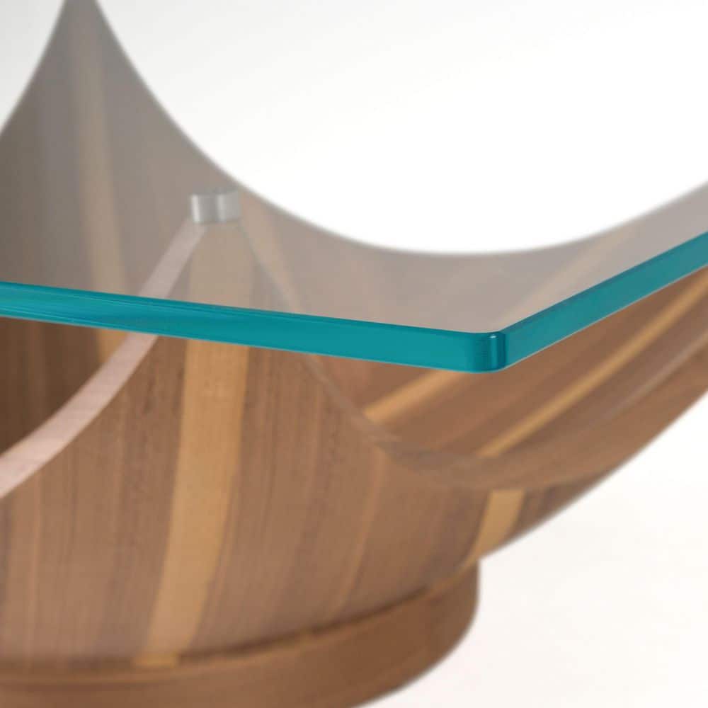 Detail of the glass corner and curved walnut base