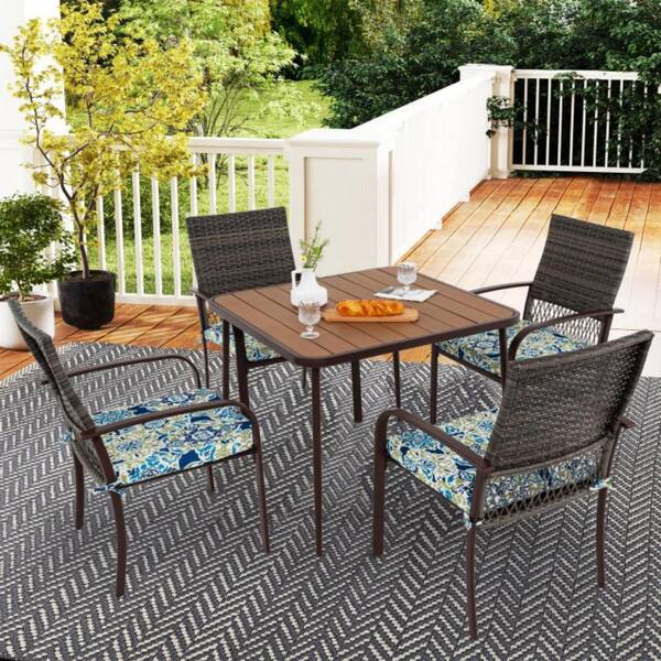 5-piece wicker patio dining set with umbrella hole Outdoor Multi-Brown Round  NobleHouseFurniture This patio dining table with steel frame is covered with e 5-Piece Wicker all-weather Outdoor Dining