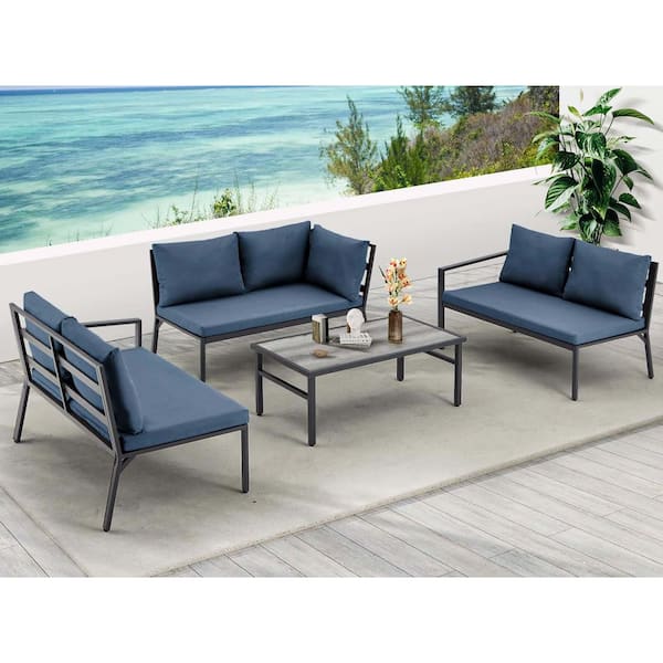 Zeus & Ruta 4-Piece Black Aluminum Outdoor Conversation Set with Blue Cushions and 1-Wood Top Coffee Table
