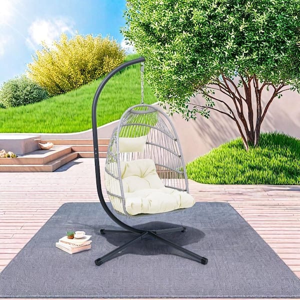 Cesicia 1-Person Wicker Patio Swing with Black Steel Stand and Off White Cushion