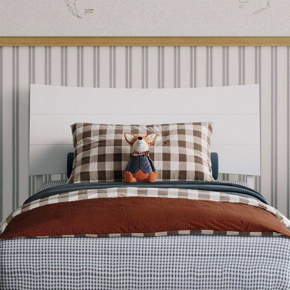 Front view of the headboard and bedding on a white wooden twin bed.