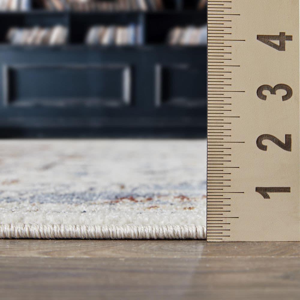 Cream and Blue 6' x 9' Synthetic Oriental Area Rug