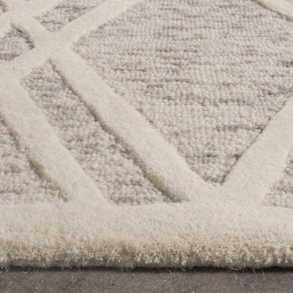 Hand-Tufted Wool Round Rug in Light Brown & Ivory, 3' x 5'