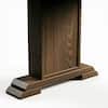 Close-up of the wooden pedestal base of the desk.