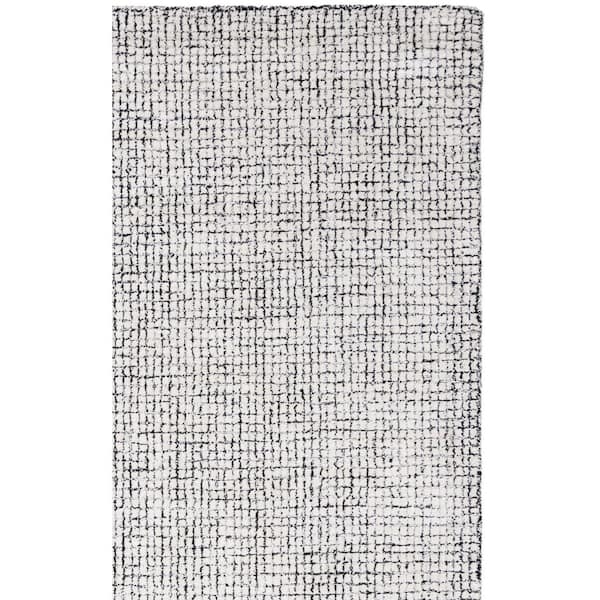 Abstract 10 ft. x 14 ft. Ivory/Black Solid Color Area Rug