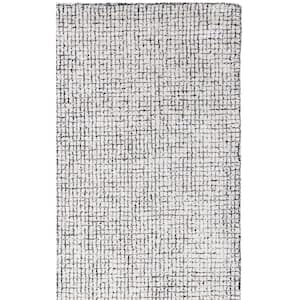 Abstract 8 ft. x 10 ft. Ivory/Black Solid Color Area Rug
