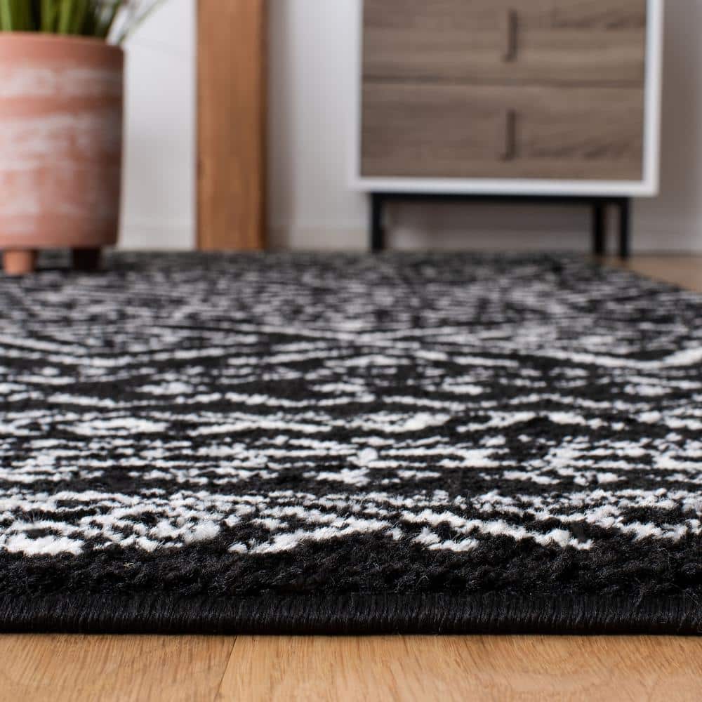Geometric Black/Ivory Synthetic 8' x 10' Hand-knotted Area Rug