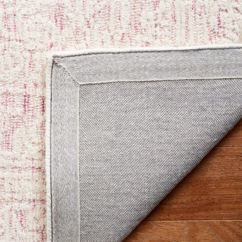 Handmade Pink and Ivory Wool Tufted 6' x 9' Area Rug